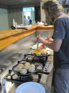 Cooking dinner at Hone Heke Lodge budget accommodation Kerikeri