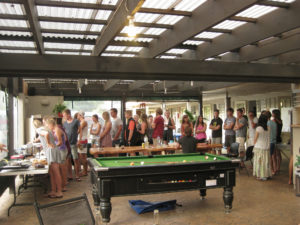 Queuing up for the pot luck dinner at Hone Heke Lodge budget accommodation Kerikeri