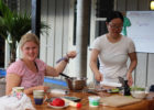 Guests preparing a salad at Hone Heke Lodge budget accommodation Kerikeri