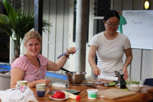 Guests preparing a salad at Hone Heke Lodge budget accommodation Kerikeri