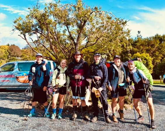A group of adventurers setting off for Cape Reinga from Kerikeri Lodge, their Te Araroa Trail accommodation.