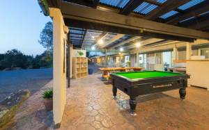 The pool table is always popular at Hone Heke Lodge backpackers Kerikeri