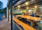 Courtyard dining area before the evening rush at Hone Heke Lodge backpackers Kerikeri