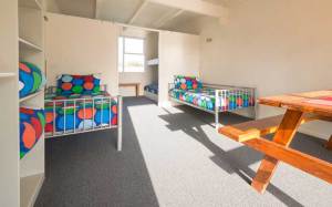 Dorm room in daylight at Hone Heke Lodge backpackers Kerikeri