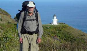 Te Araroa trail blog - Bob at Cape Reinga with lighthouse in background